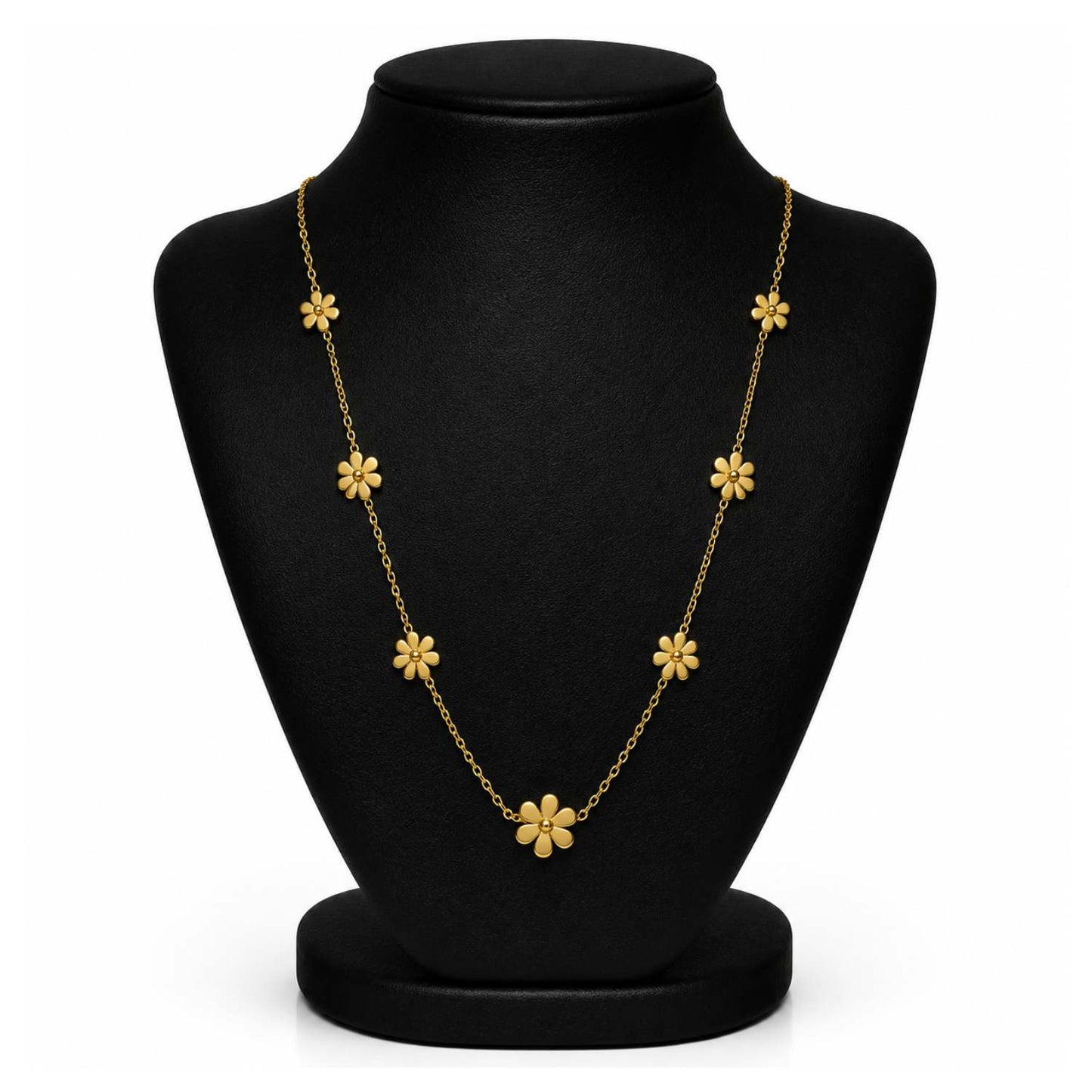 A gold floral necklace displayed on a black jewelry bust against a white background.