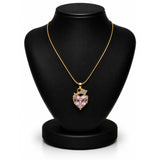 A gold chain necklace with a heart-shaped pink gemstone pendant, displayed on a black jewelry bust against a white background.