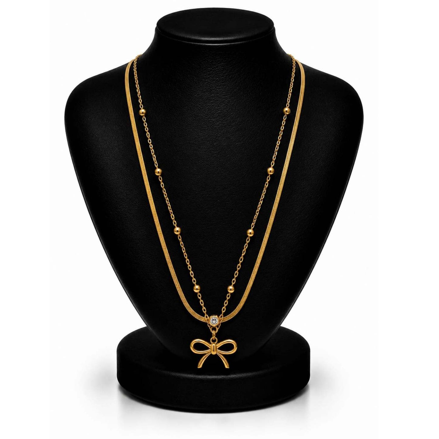 Women's 18K gold plated bow layered necklace on white background