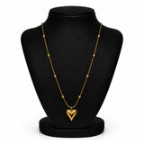 A gold heart pendant necklace displayed on a black jewelry bust against a white background.