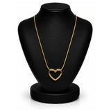 A gold heart-shaped pendant necklace displayed on a black jewelry bust against a white background.