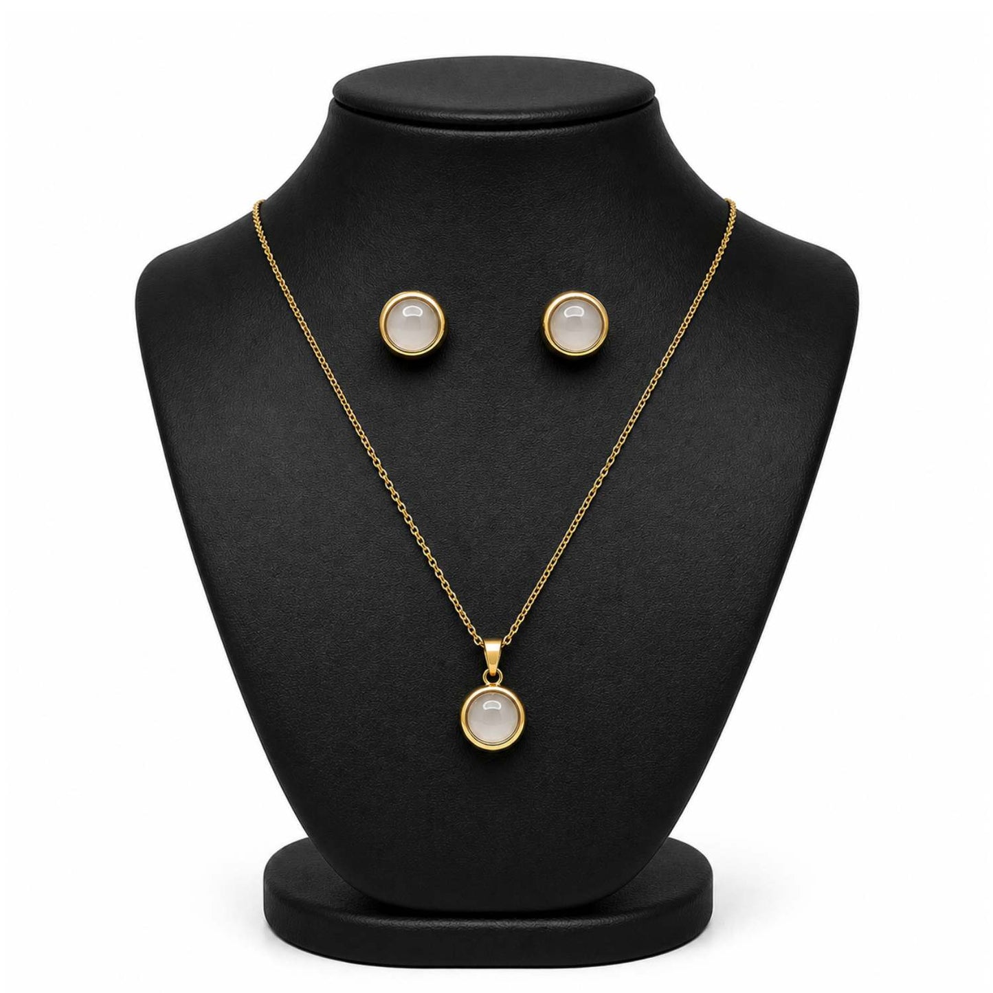 Gold jewelry set featuring a pendant necklace and matching stud earrings displayed on a black jewelry bust against a white background.