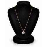 A gold necklace with a round-cut clear gemstone pendant displayed on a black jewelry bust against a white background.